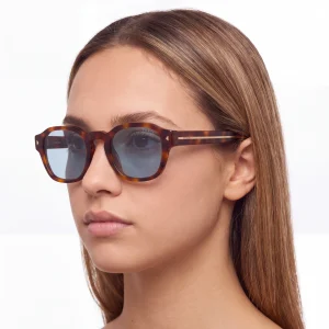 tortoiseshell sunglasses with the iconic metal plaque