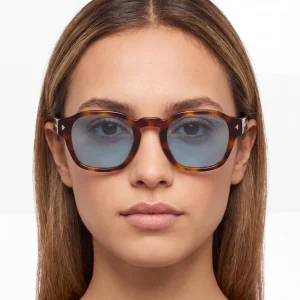 tortoiseshell sunglasses with the iconic metal plaque